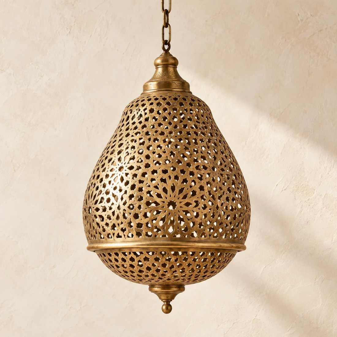 Hand-pierced brass pendant